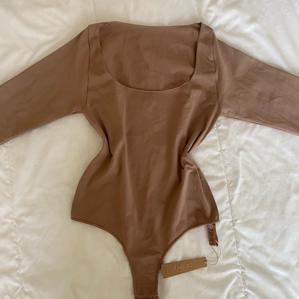SKIMS Long Sleeve Scoop Neck Bodysuit in Sienna